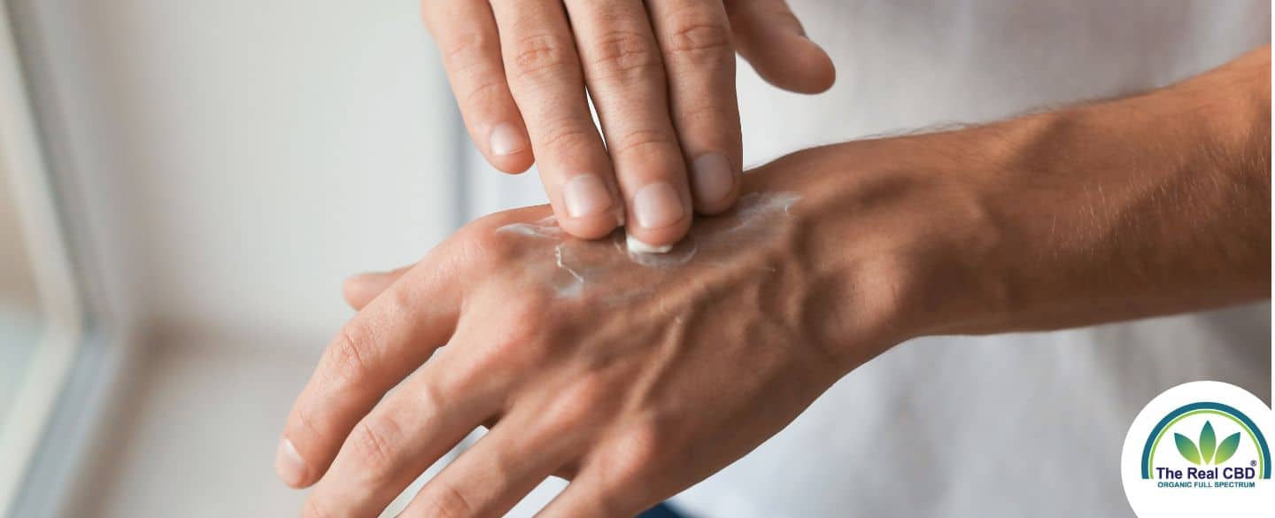 Hand applying crème onto the opposite hand