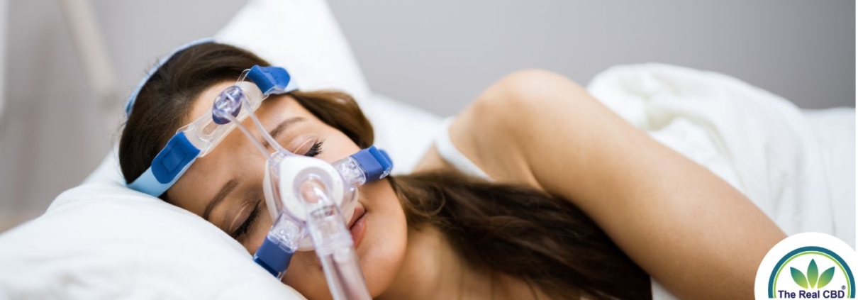 Woman sleeping with an oxygen mask on