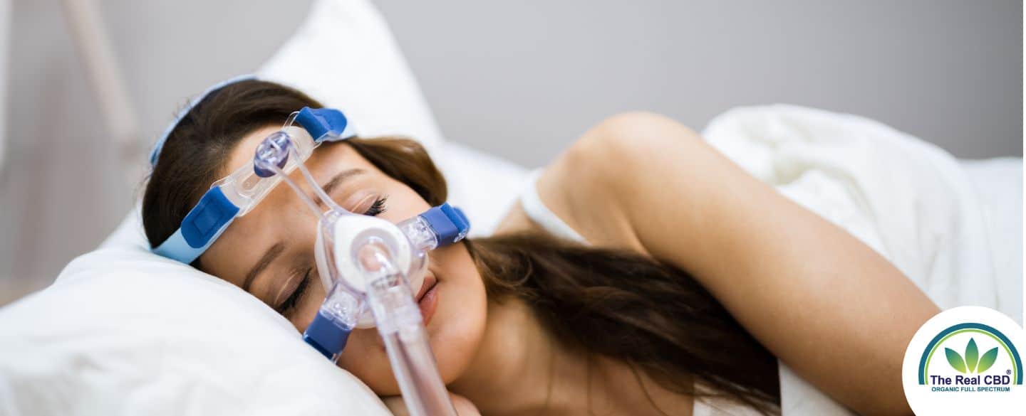 Woman sleeping with an oxygen mask on