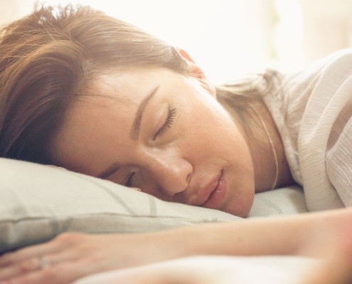 Sleeping woman's head on a pillow