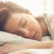 Sleeping woman's head on a pillow