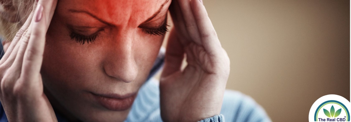 Woman holding her head in pain