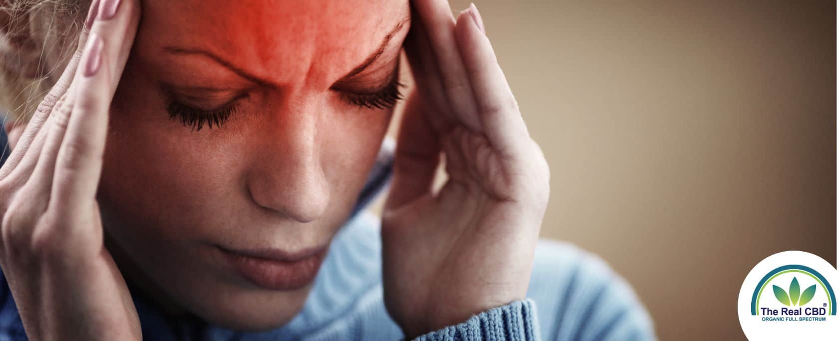 Woman holding her head in pain