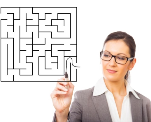 Woman start a maze with a black marker pen