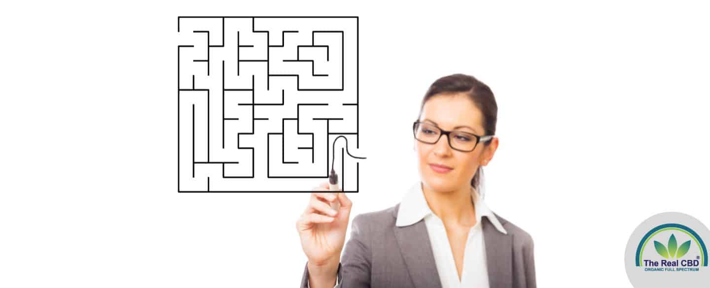 Woman start a maze with a black marker pen