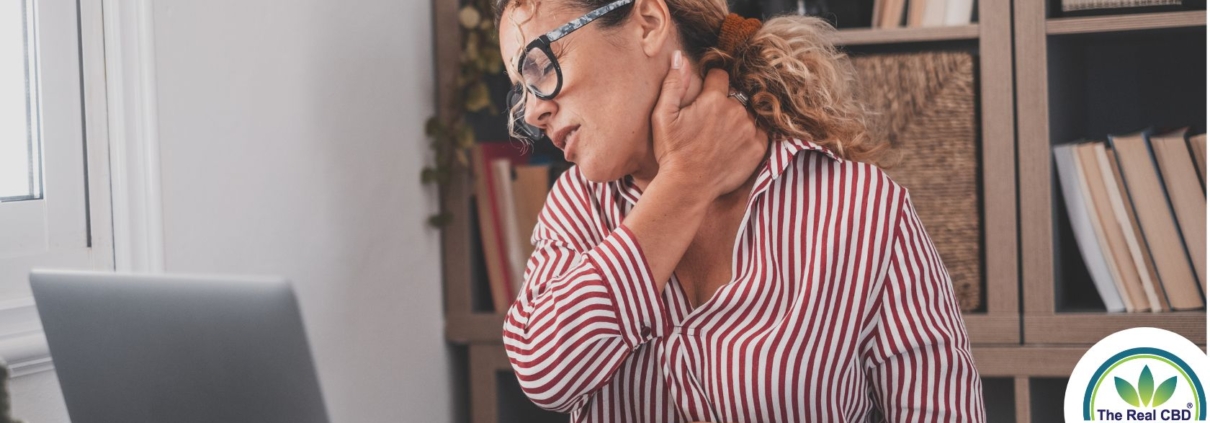 Woman holding her neck in pain