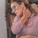 Woman holding her neck in pain