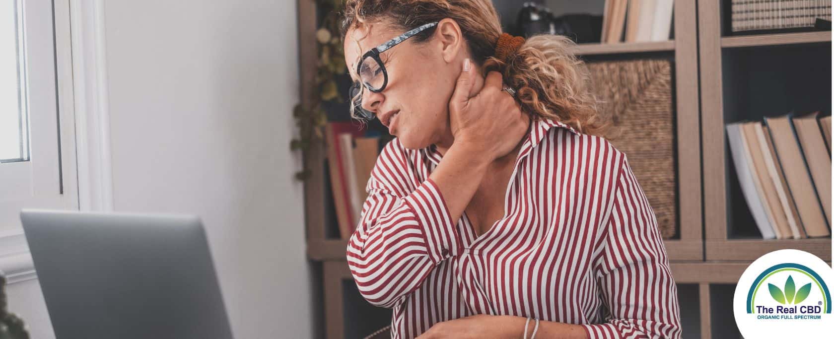 Woman holding her neck in pain