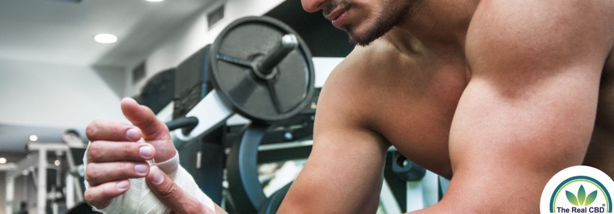 Injured man with bandage in a gym