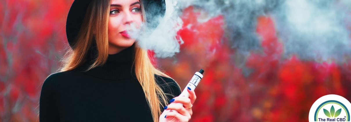 Young pretty woman in back blowing vape smoke on a red background