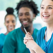 A team of happy nurses in scrubs