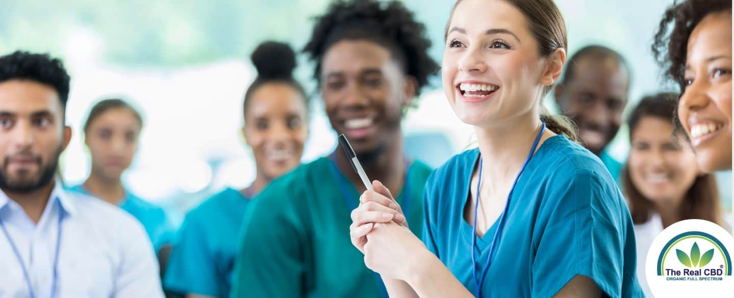 A team of happy nurses in scrubs