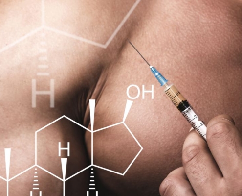 Muscular man with syringe wanting to inject himself