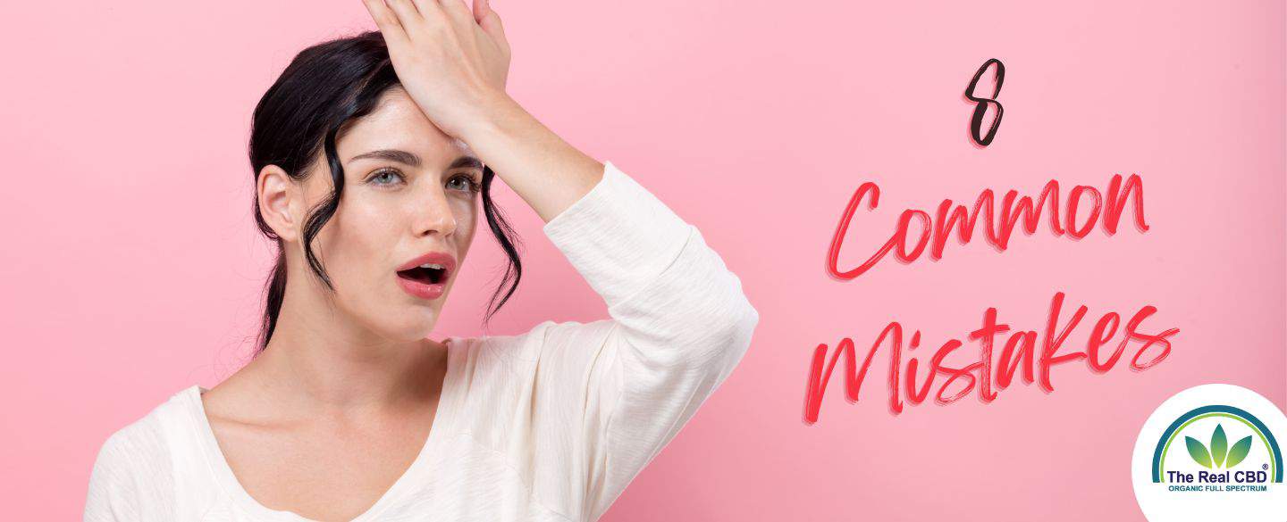 Woman holding her forehead with 8 common CBD mistakes