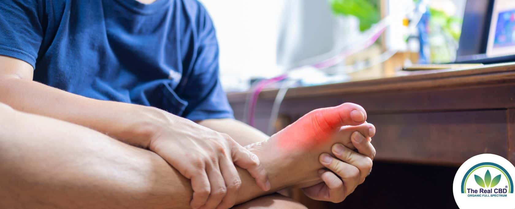 Man holding his foot with signs of Gout