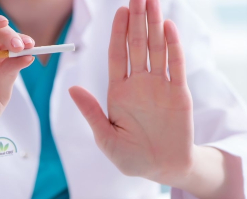 Doctor holding a cigarette asking to stop