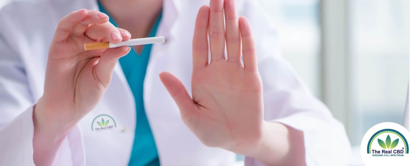 Doctor holding a cigarette asking to stop