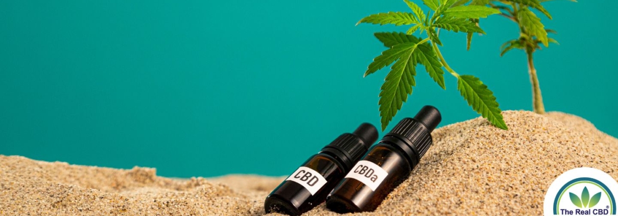 CBD and CBA oil bottles in the sand