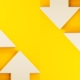 White arrows going up and down on a yellow background