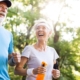 Happy old couple running in the forrest