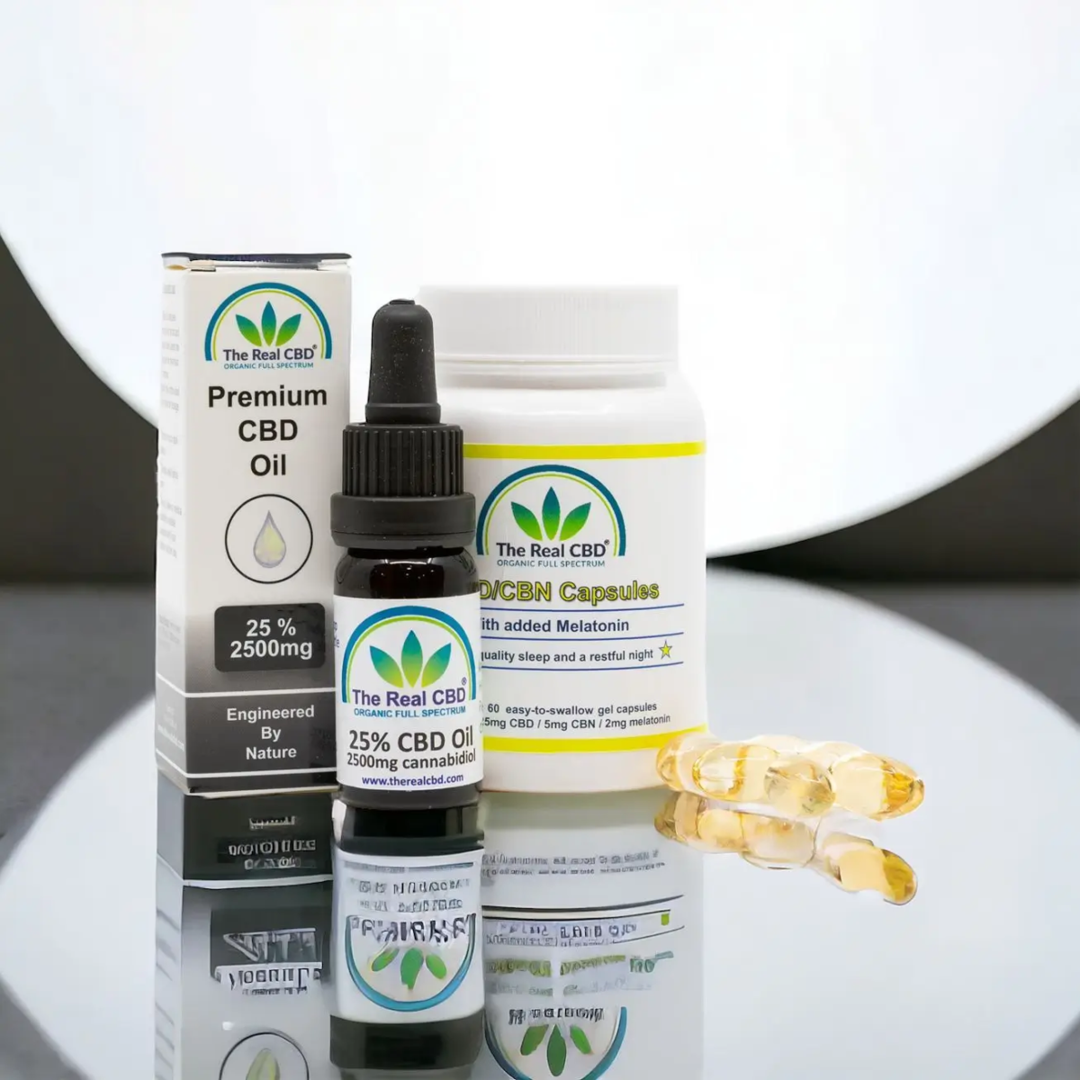 25% CBD oil and Capsules displayed on a mirror - The Real CBD Brand