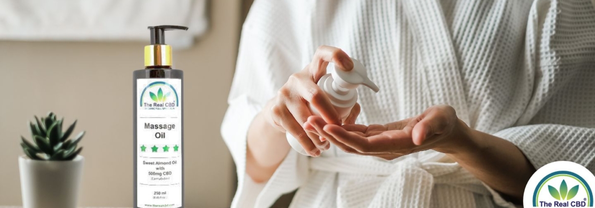 Woman in bathrobe squirting crème onto her hand