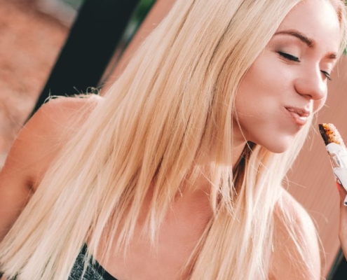 Blond woman enjoying some food