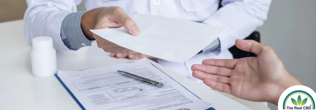 Doctor handing over a prescription to a patient