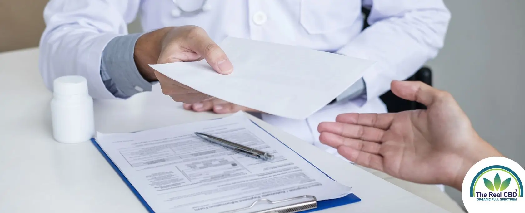 Doctor handing over a prescription to a patient