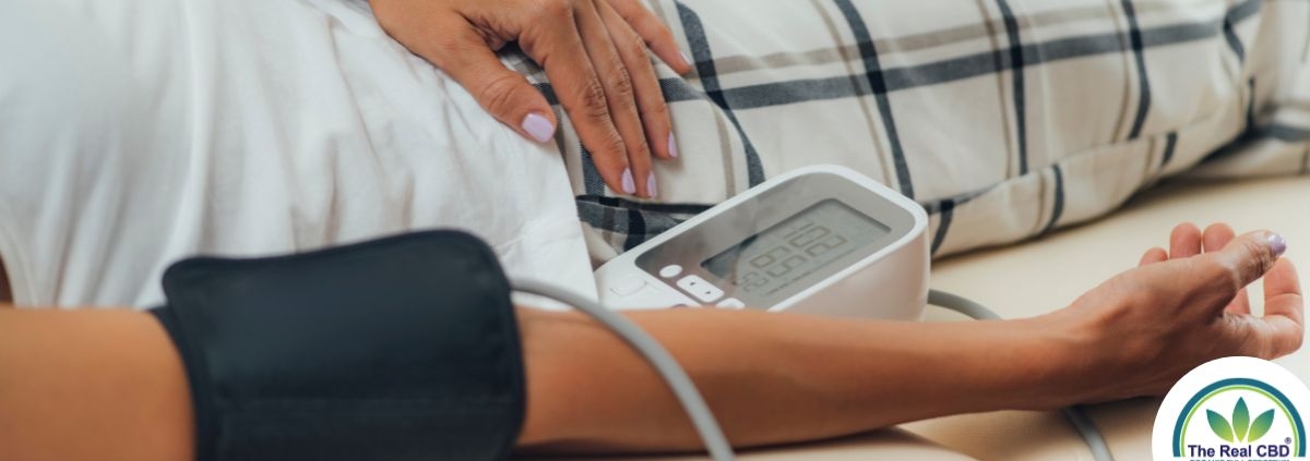 Person laying down having their blood pressure measured