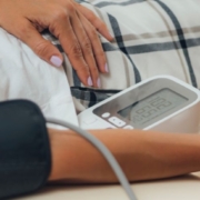 Person laying down having their blood pressure measured